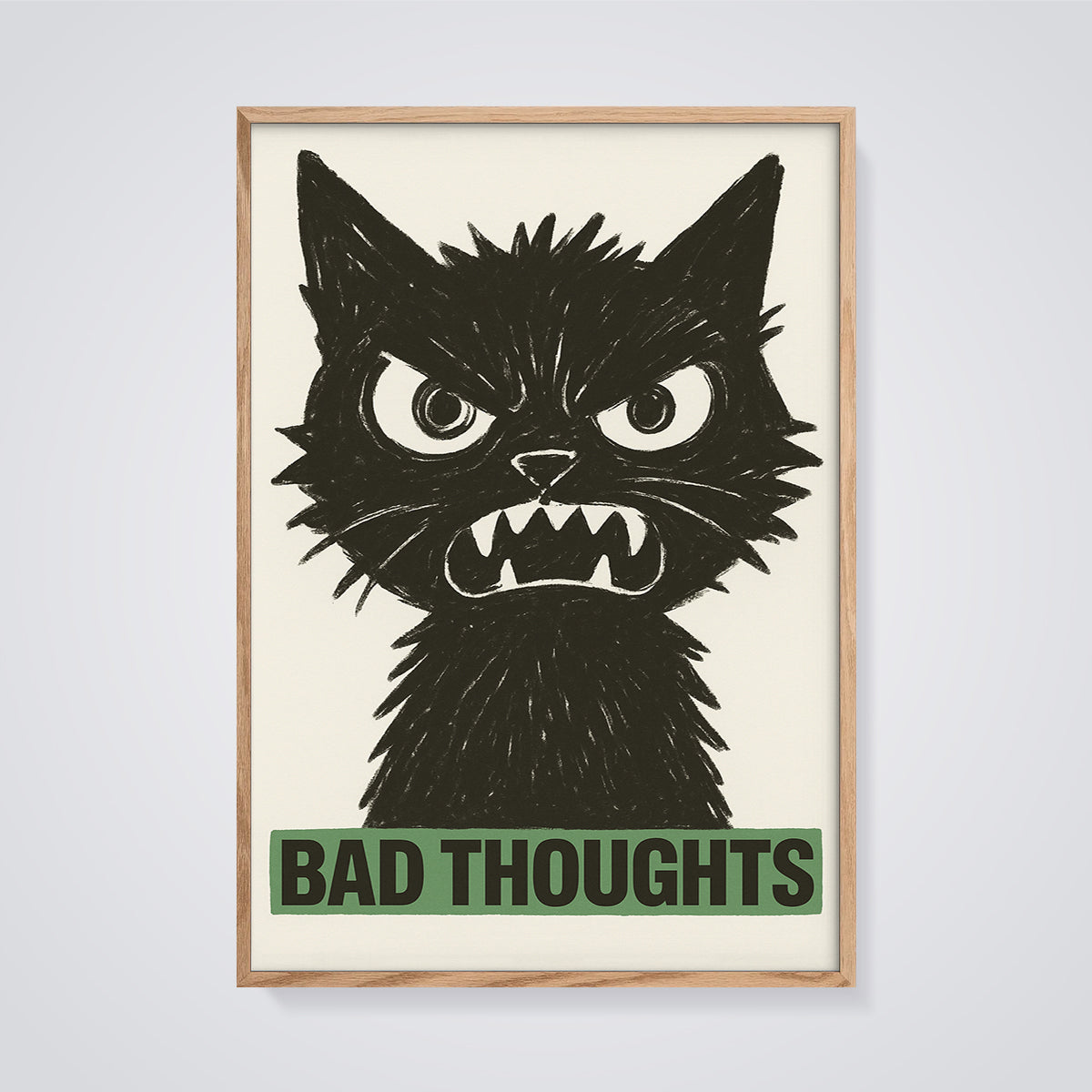 Bad Thoughts Angry Black Cat Print framed in oak on a grey background