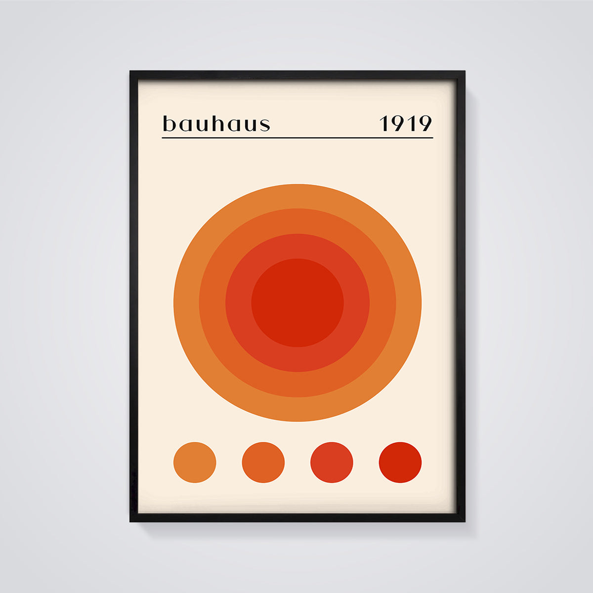 Bauhaus 1919 Concentric Orange Circles Print framed in black on a grey background