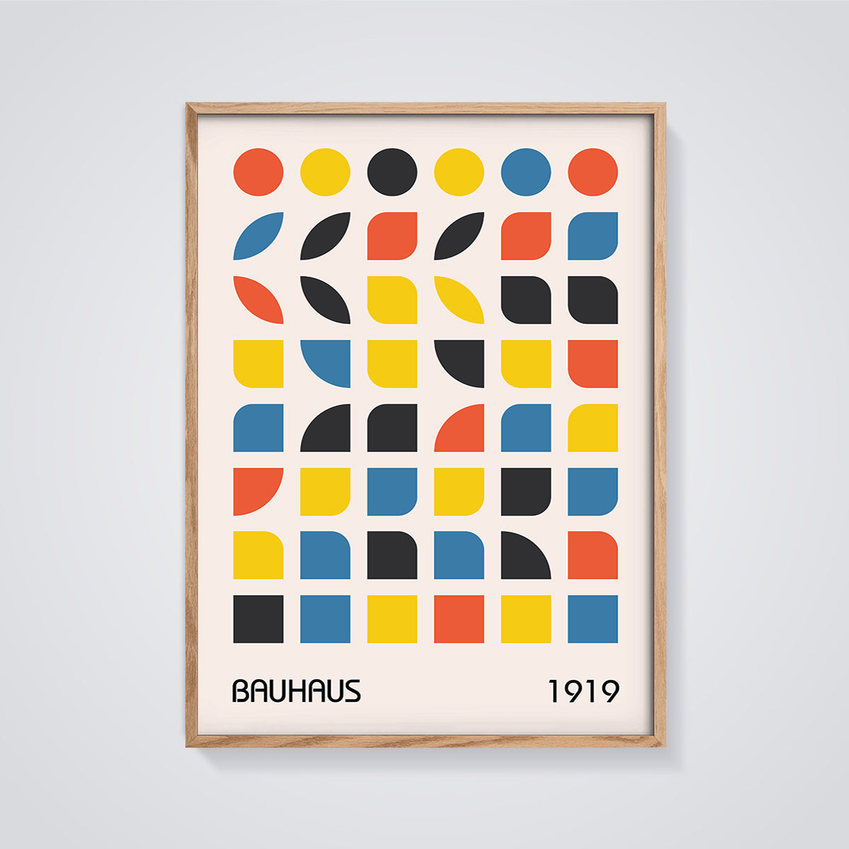 Bauhaus 1919 Geometric Grid Print framed in oak on a grey background