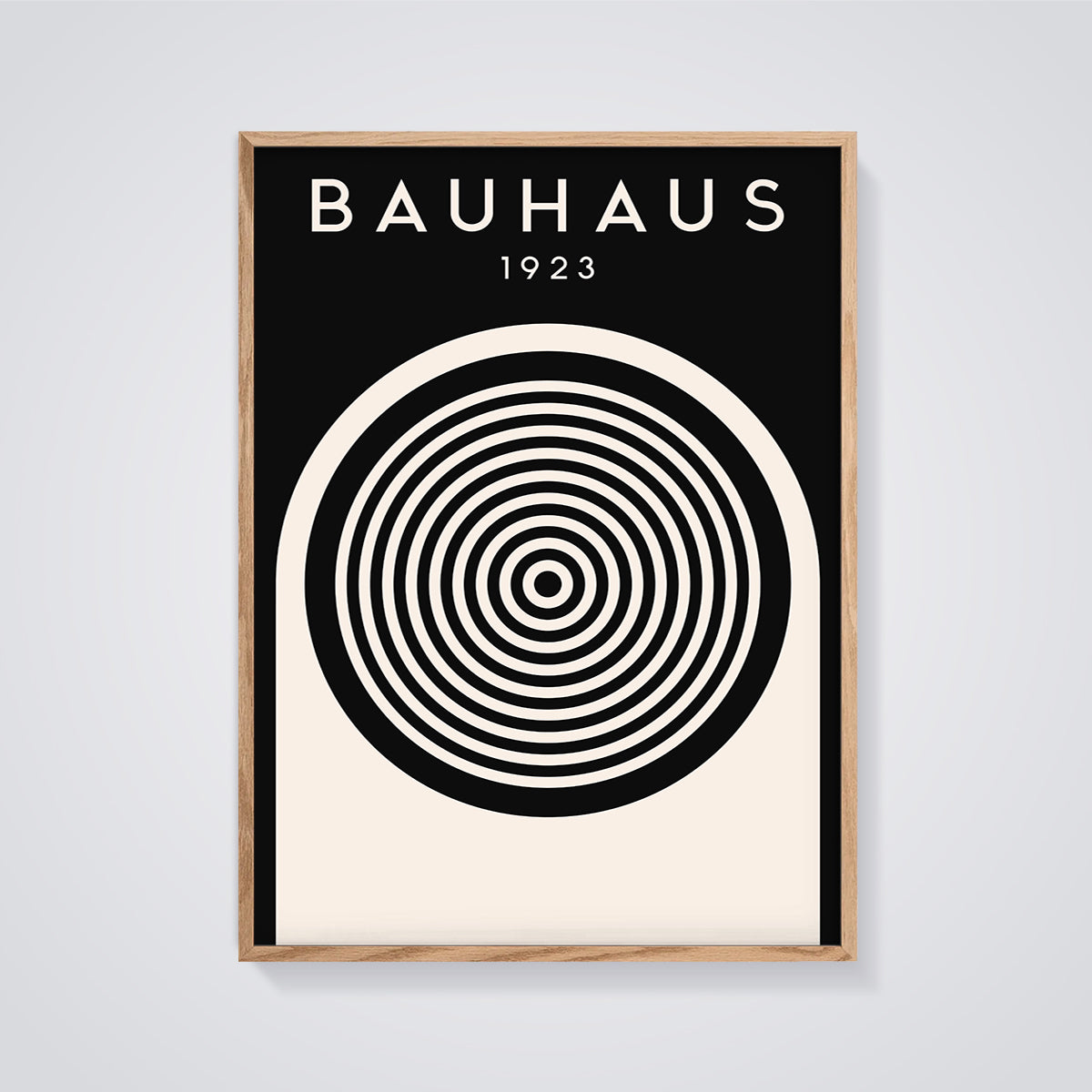Bauhaus 1923 Concentric Circles Print framed in oak on a grey background