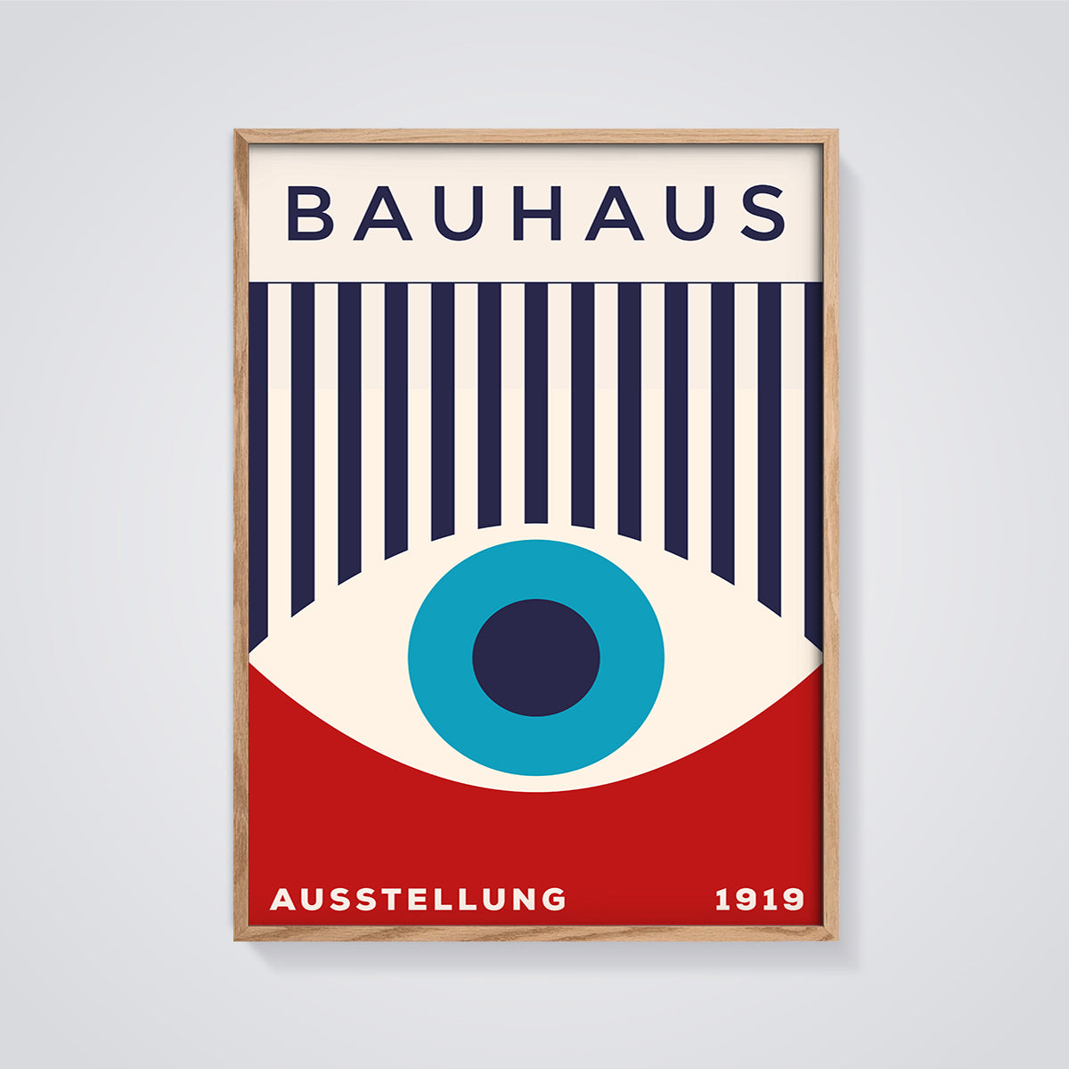 Bauhaus Exhibition Eye Print framed in oak on a grey background