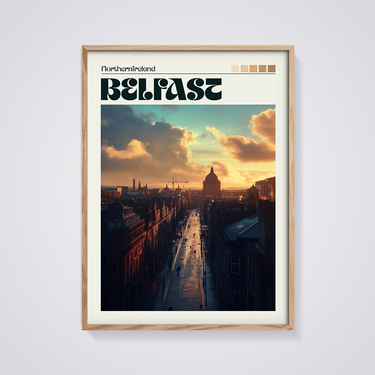 Belfast Golden Hour Cityscape Print framed in oak on a grey background