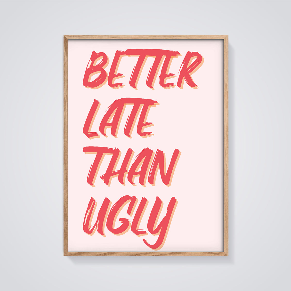 Better Late Than Ugly Quote Print framed in oak on a grey background