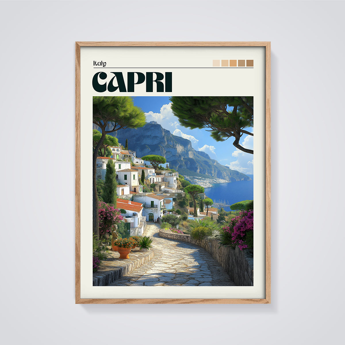 Capri Coastal Village Print framed in oak on a grey background