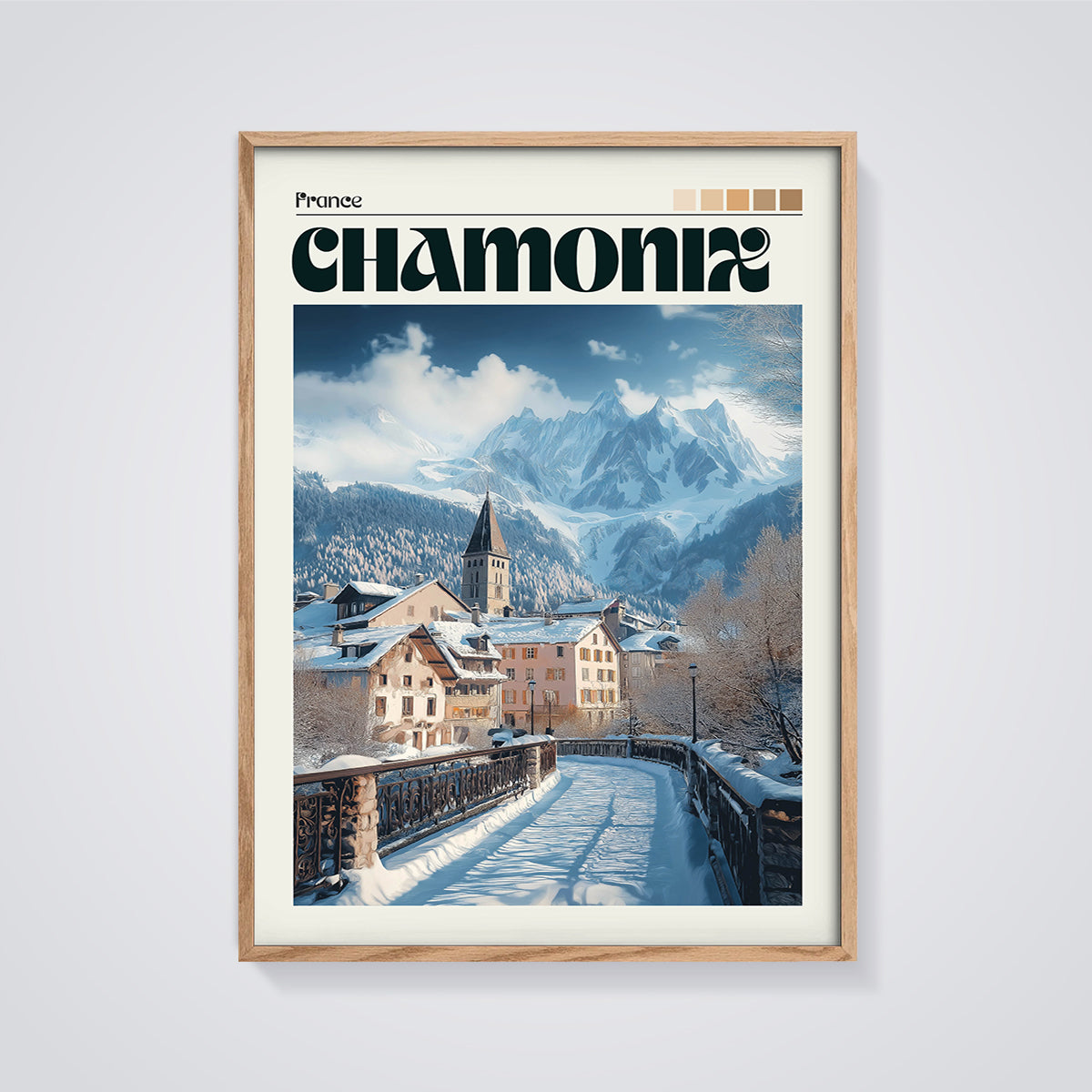 Chamonix Winter Village Print framed in oak on a grey background