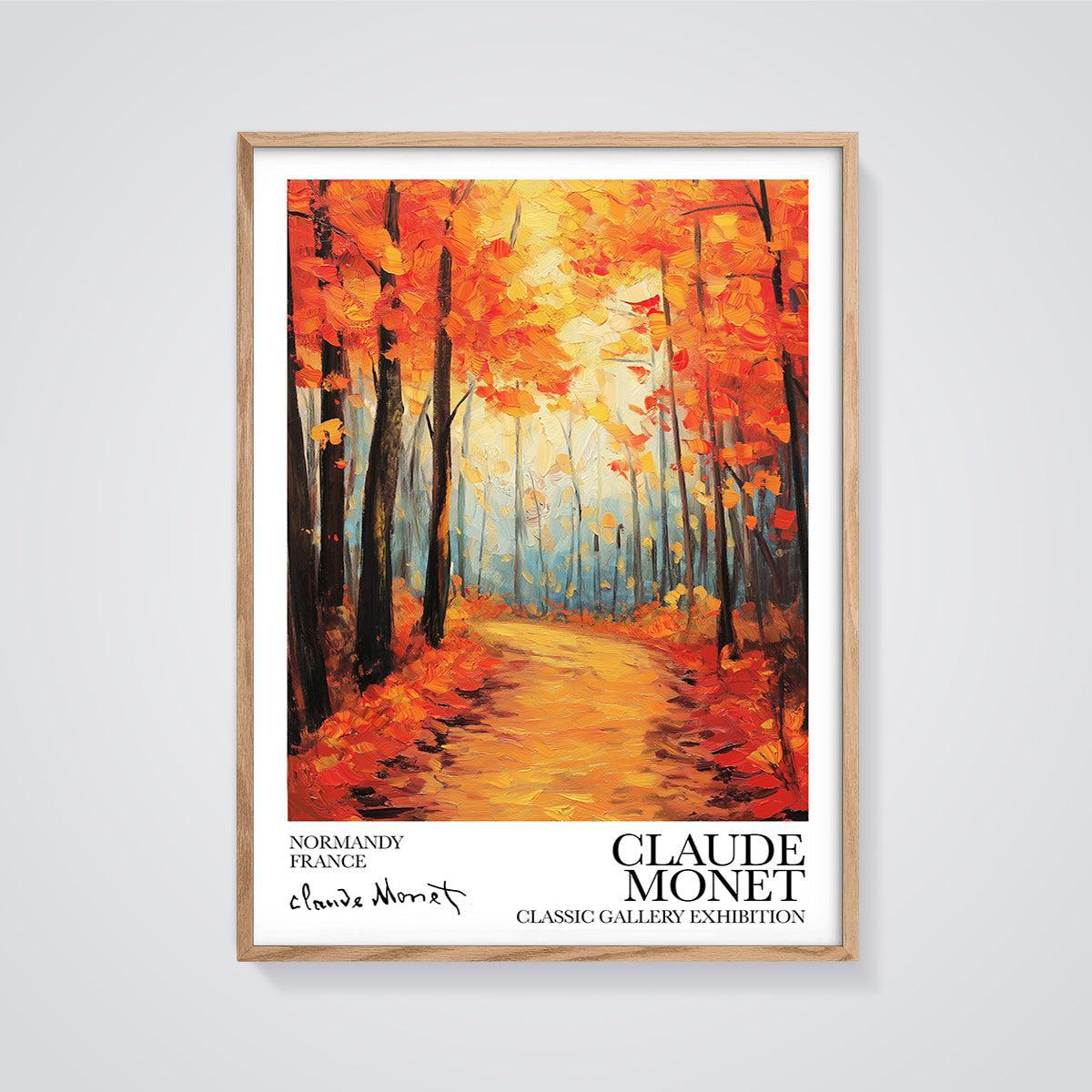 Claude Monet Autumn Forest Path Print framed in oak on a grey background