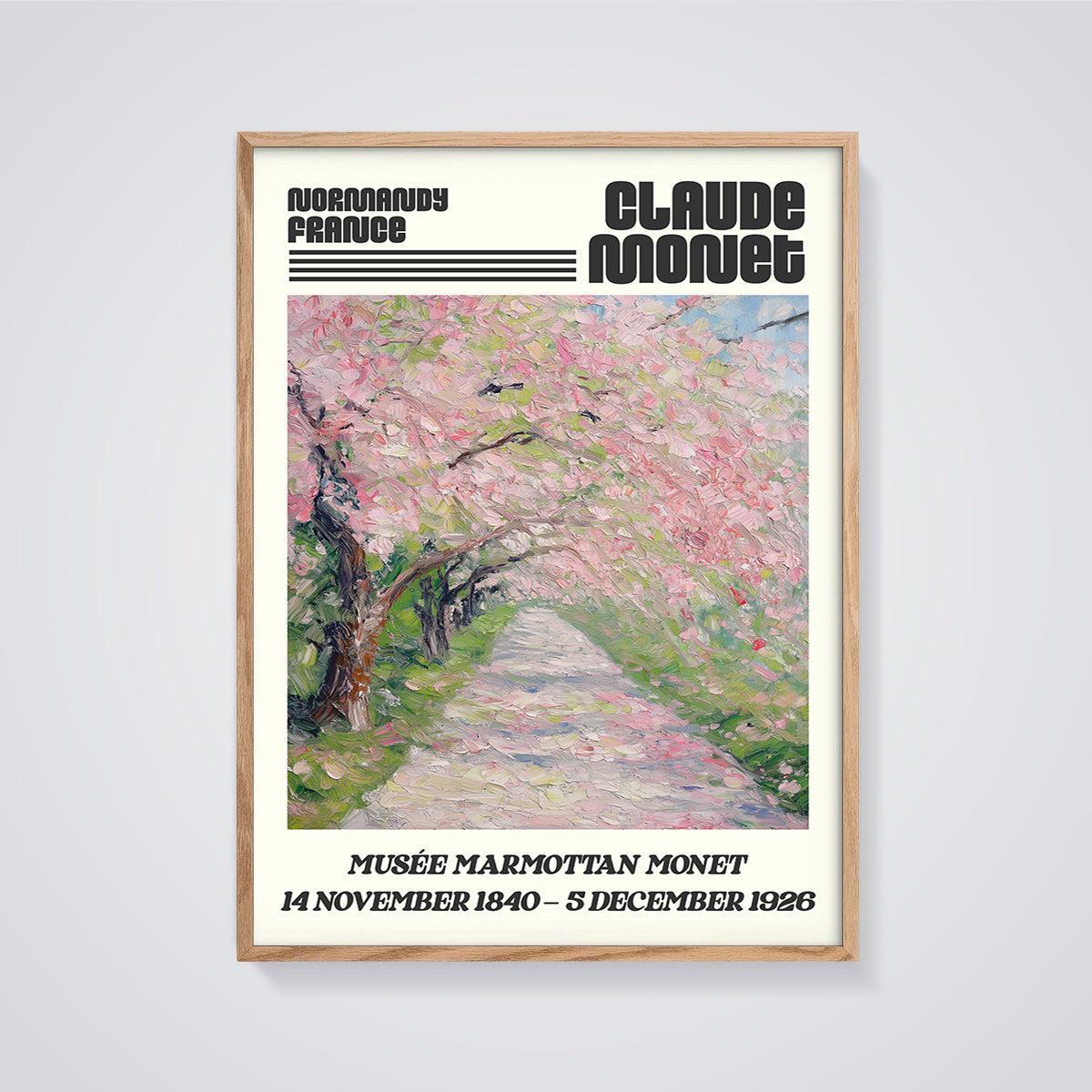 Claude Monet Blossom Path Print framed in oak on a grey background