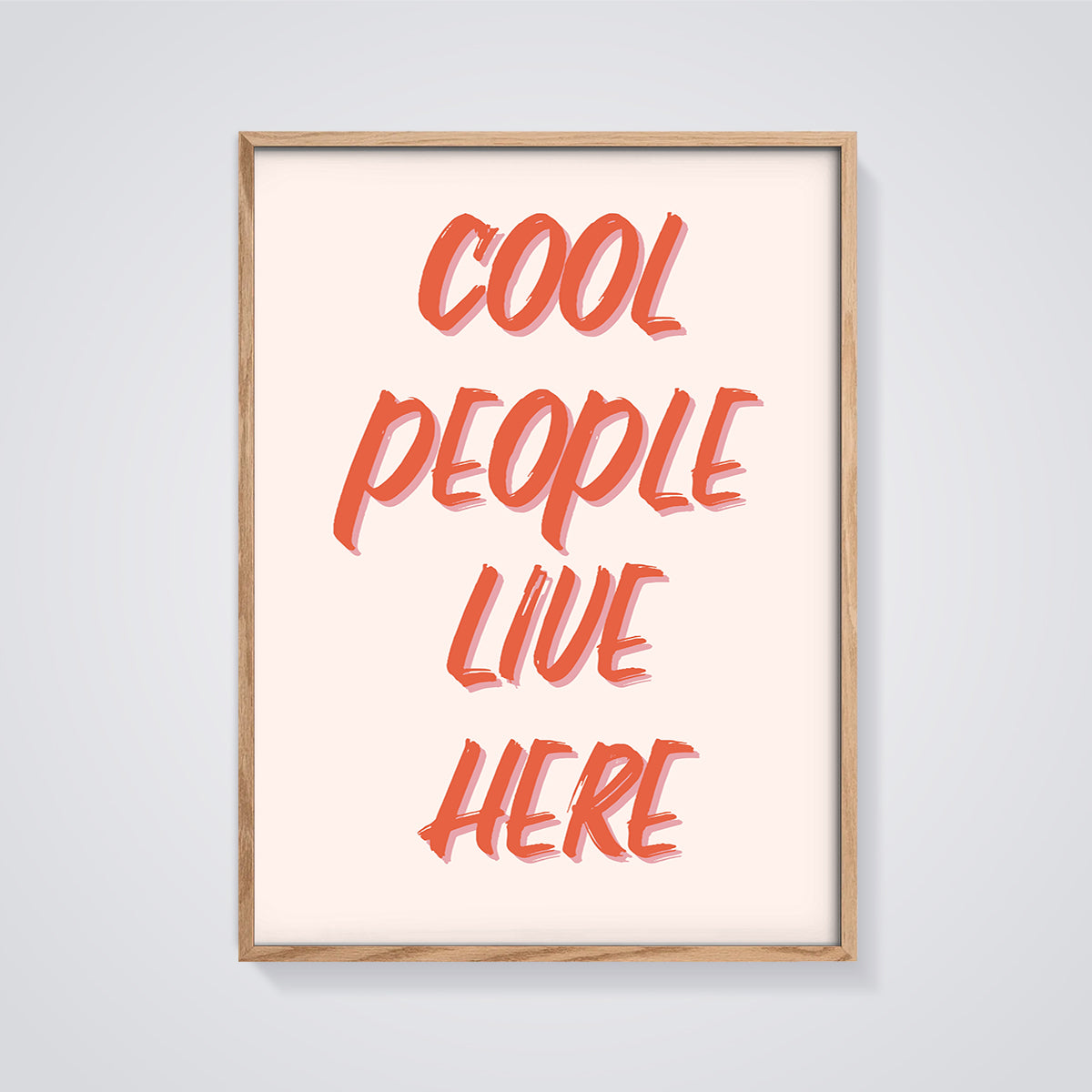 Cool People Live Here Quote Print framed in oak on a grey background