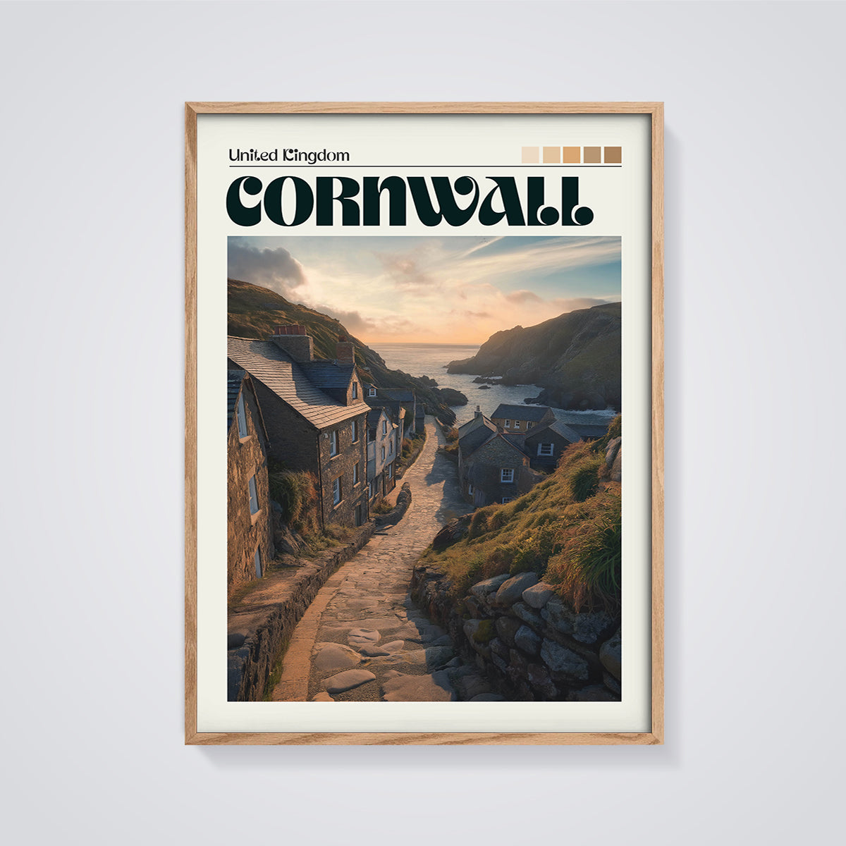Cornwall Coastal Village Print framed in oak on a grey background