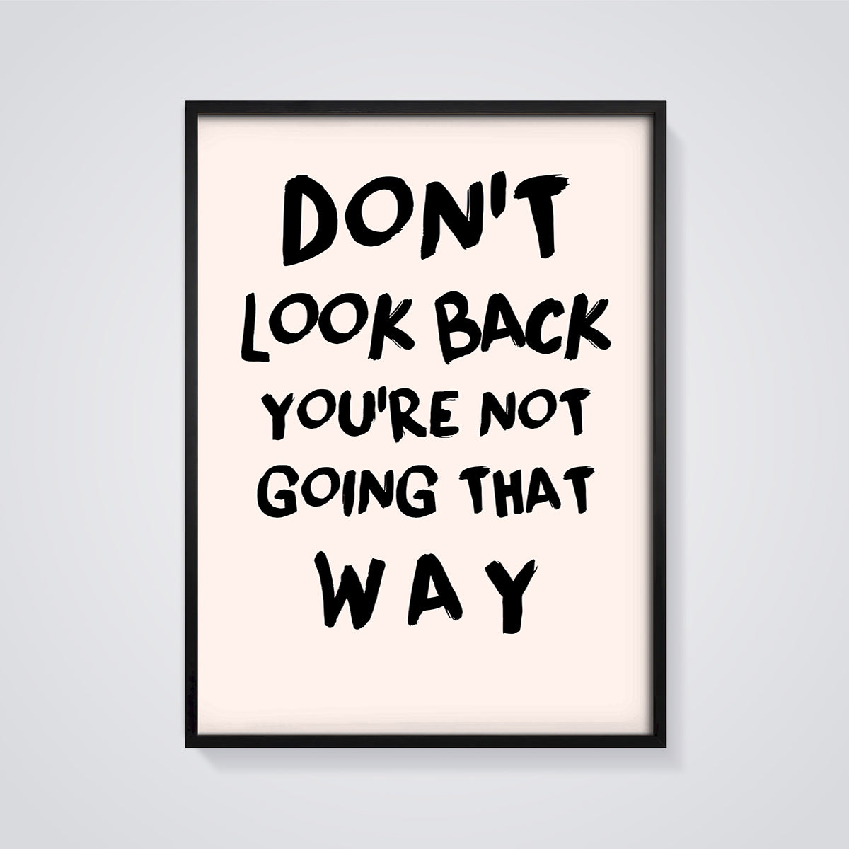 Don't Look Back Quote Print framed in black on a grey background