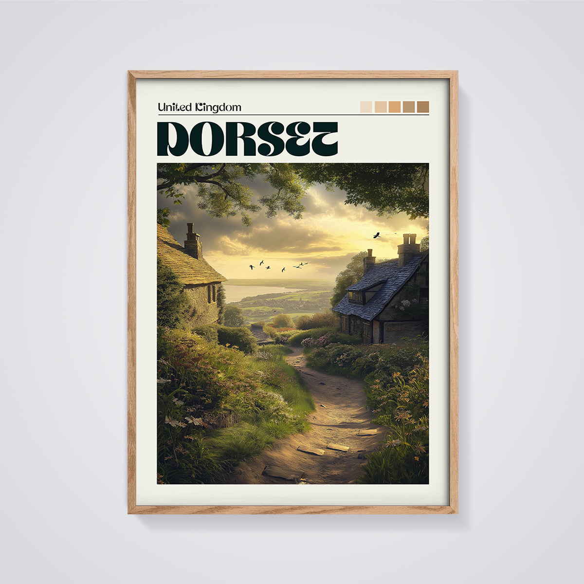 Dorset Coastal Cottages Print framed in oak on a grey background