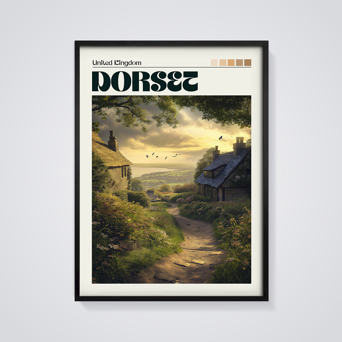 Dorset Coastal Cottages Print framed in black on a grey background