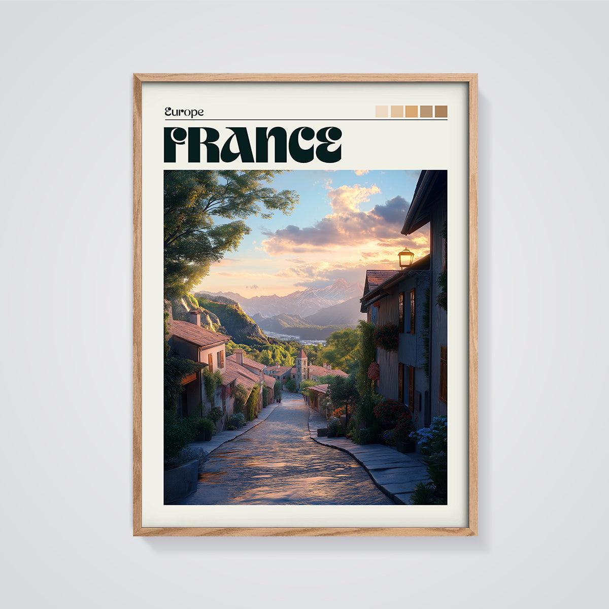France Mountain Village Print framed in oak on a grey background