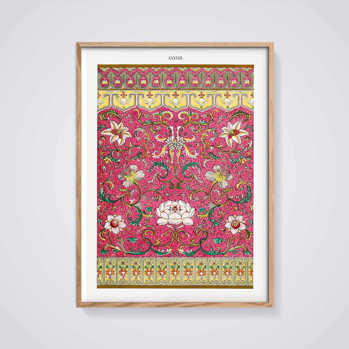 Fuchsia Ornate Floral Print framed in oak on a grey background