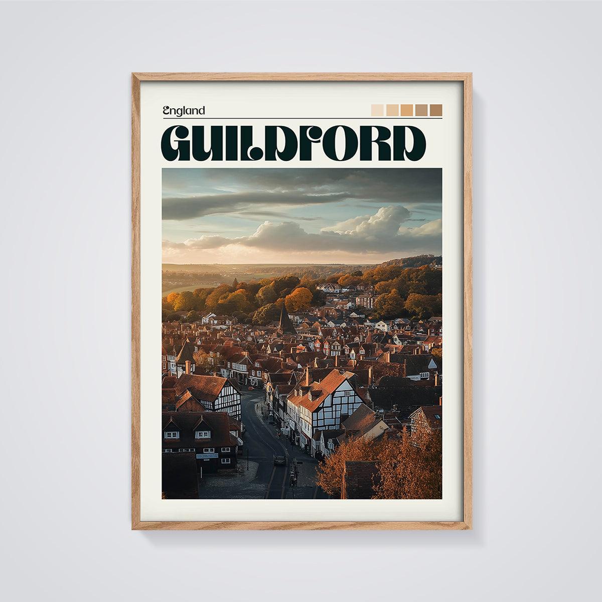 Guildford Autumn Sunset Print framed in oak on a grey background