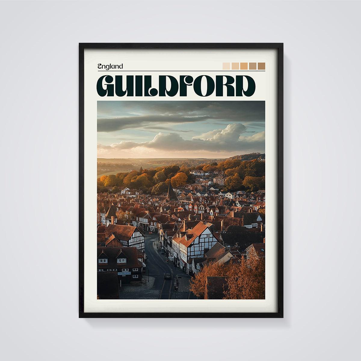 Guildford Autumn Sunset Print framed in black on a grey background