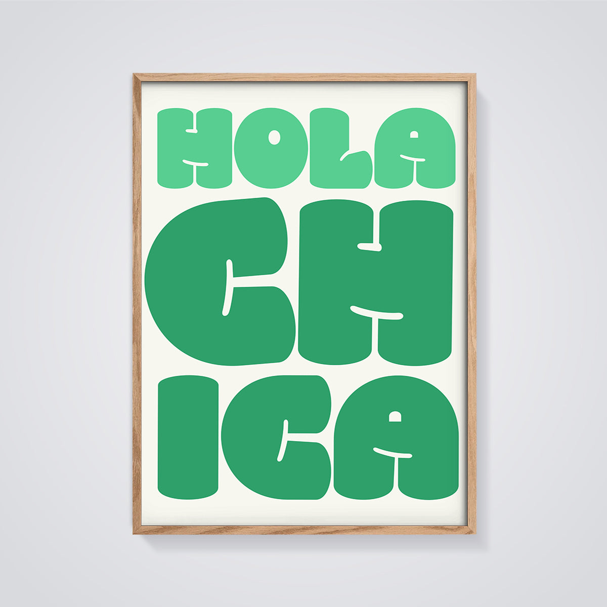 Hola Chica Typography Print framed in oak on a grey background
