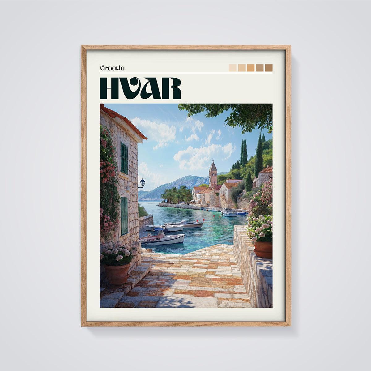 Hvar Coastal Scene Print framed in oak on a grey background