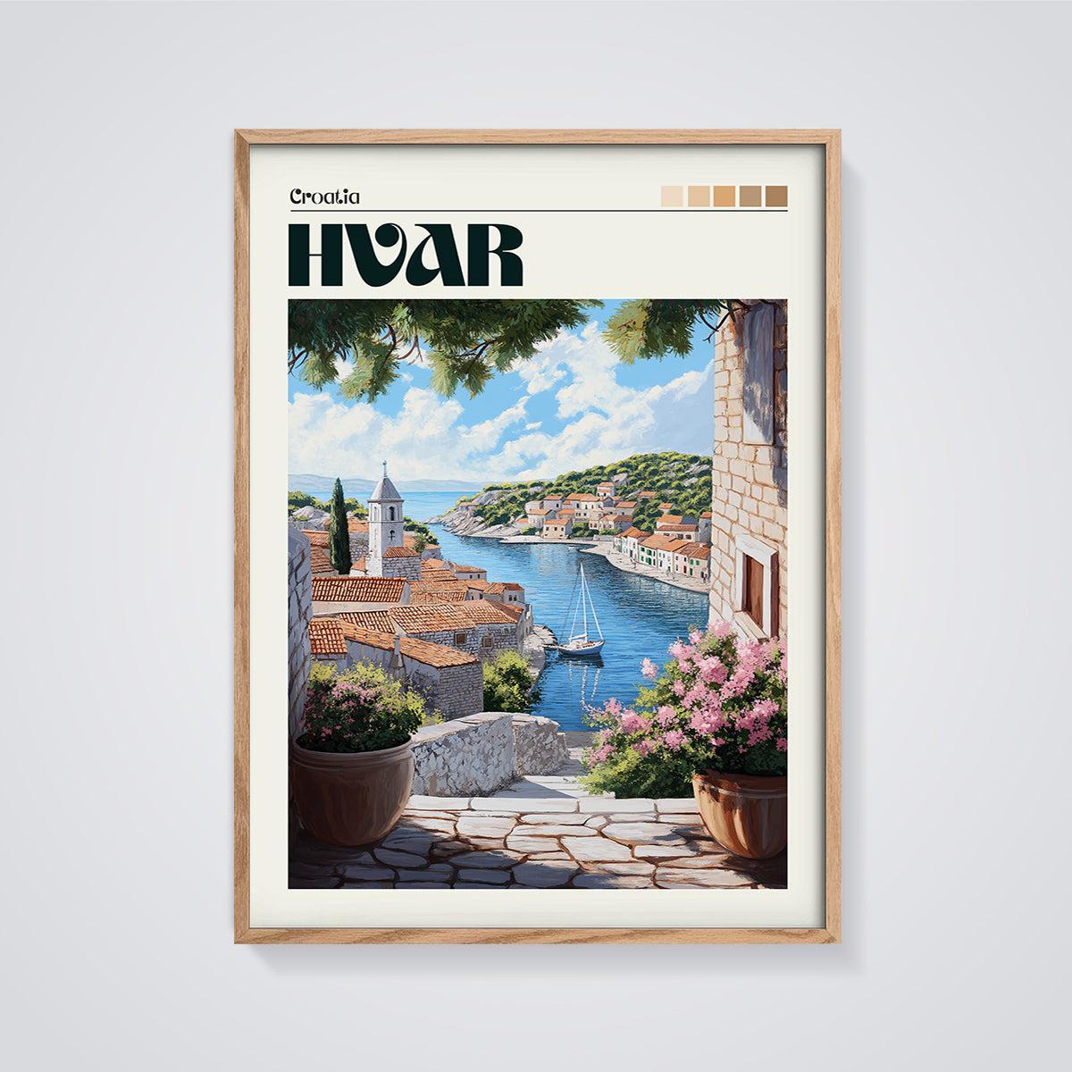 Hvar Coastal Village Print framed in oak on a grey background