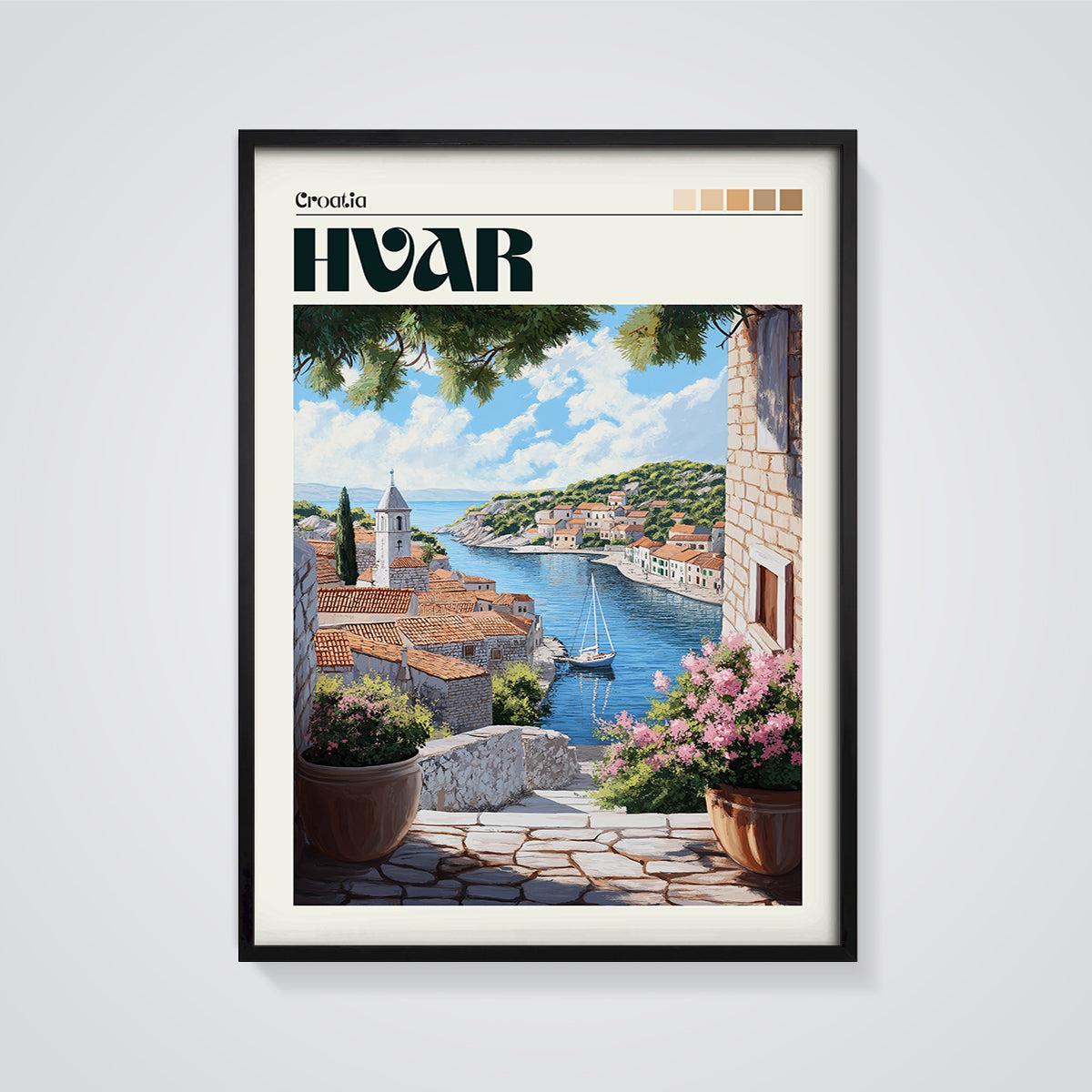Hvar Coastal Village Print framed in black on a grey background