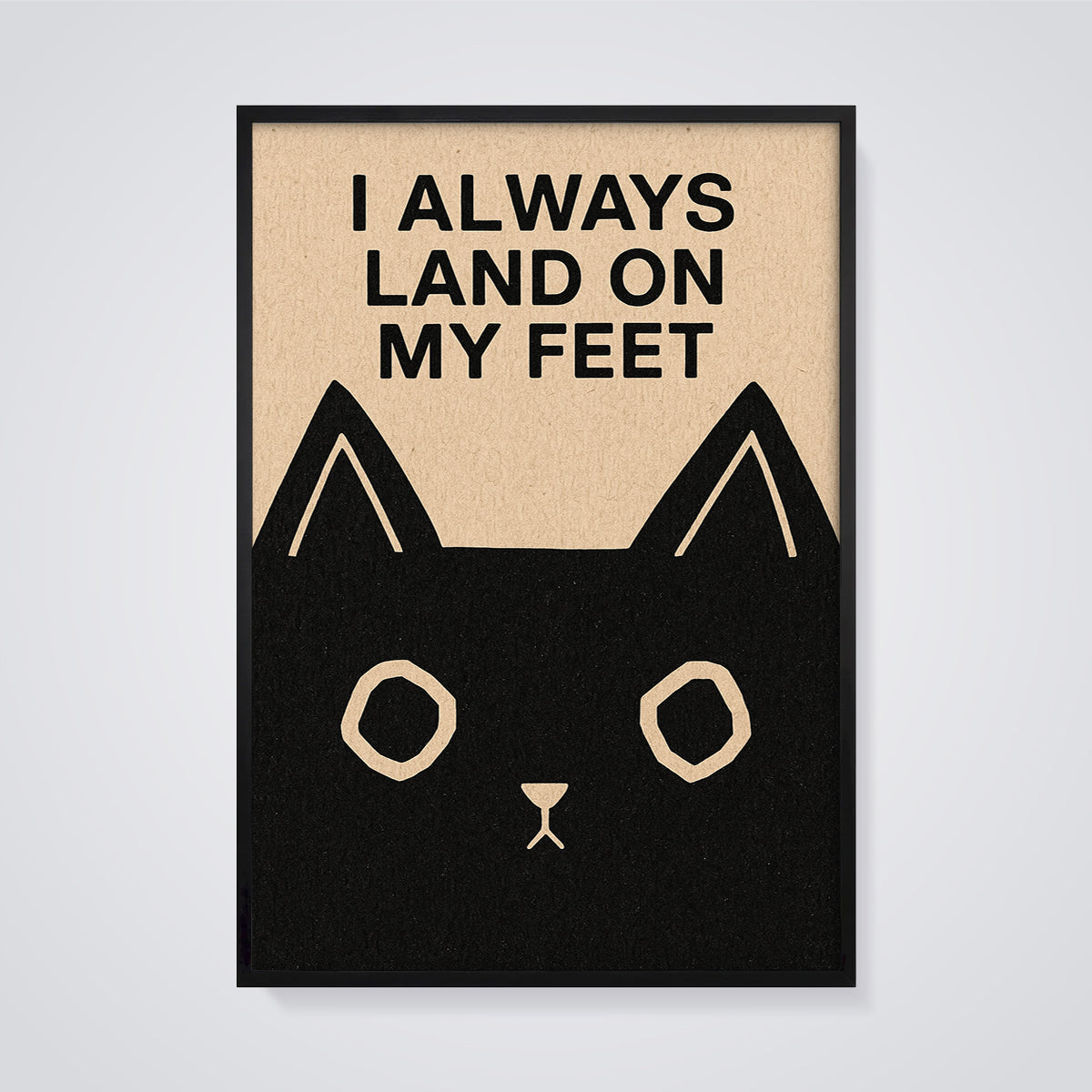 I Always Land on My Feet Cat Print framed in black on a grey background