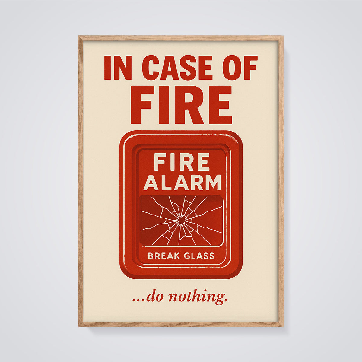 In Case of Fire Do Nothing Print framed in oak on a grey background