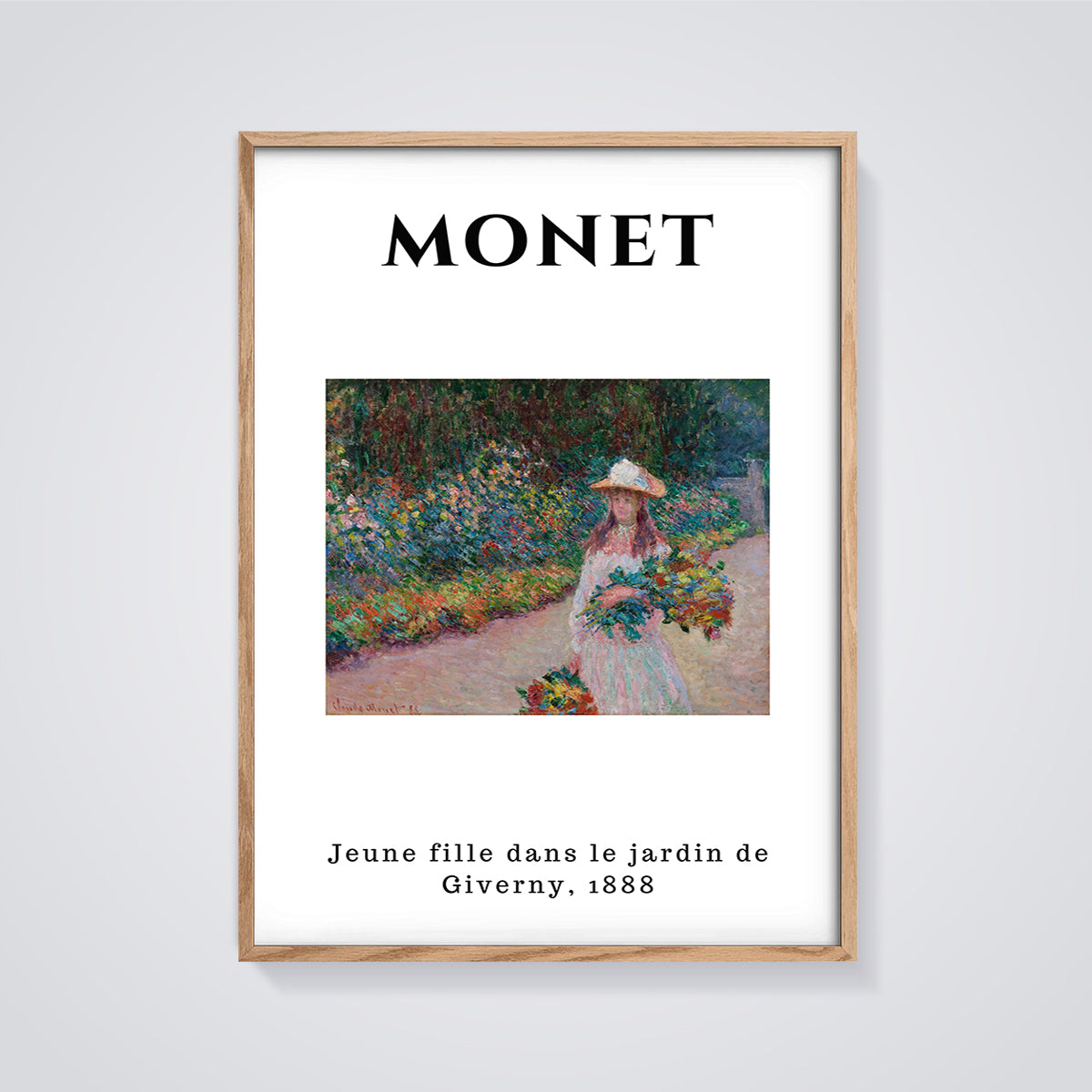 Jeune Fille dans le Jardin de Giverny Print framed in oak on a grey background