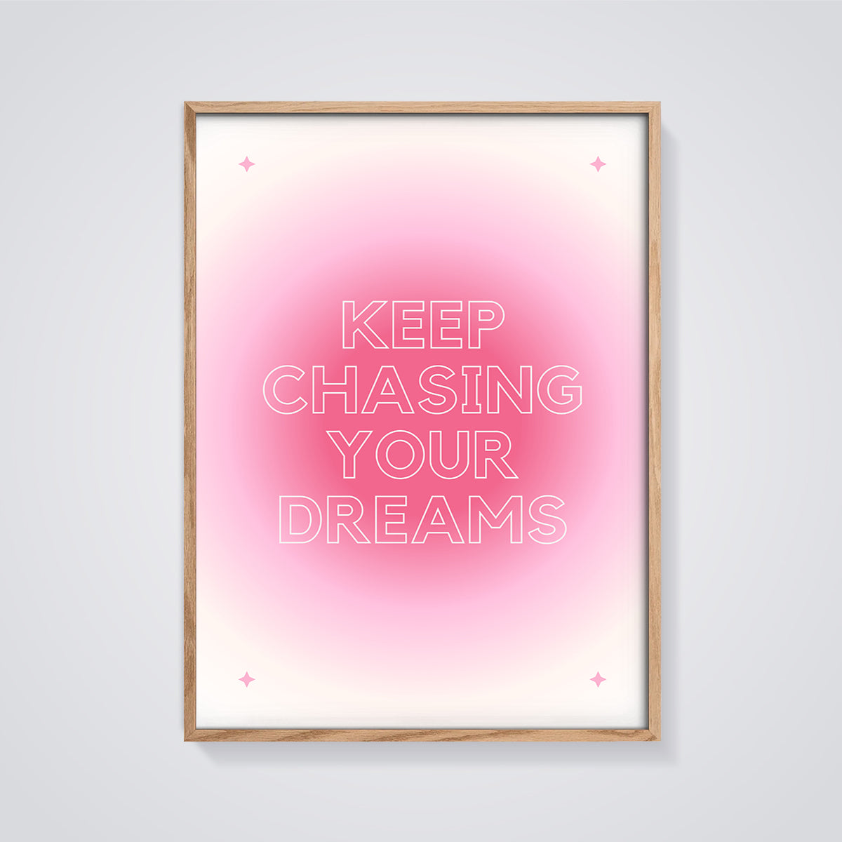 Keep Chasing Your Dreams Quote Print framed in oak on a grey background