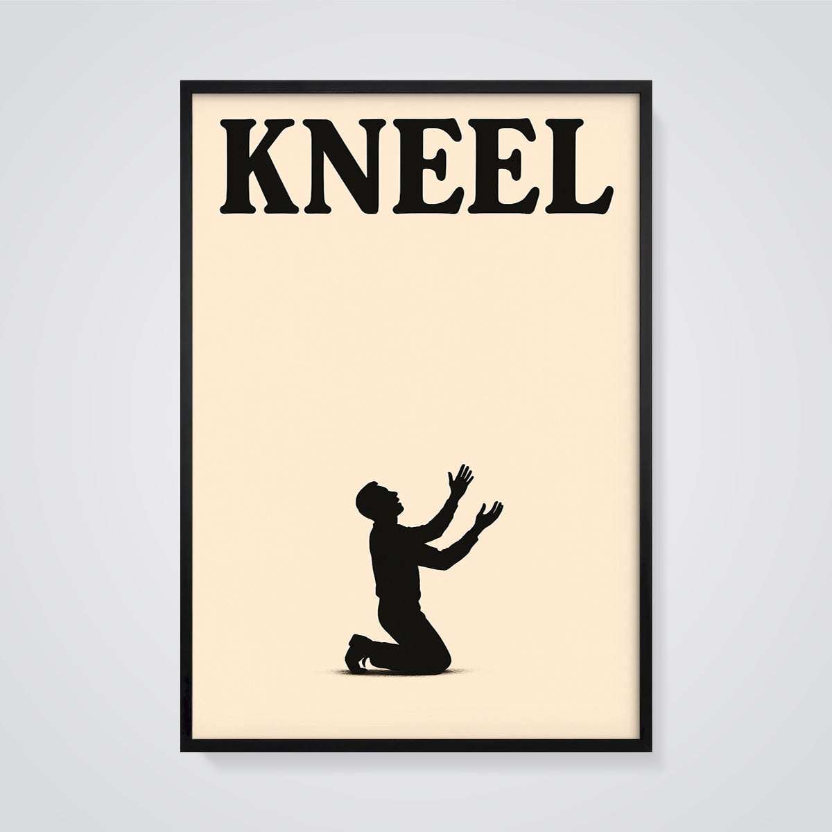Kneel Silhouette Print framed in black on a grey background