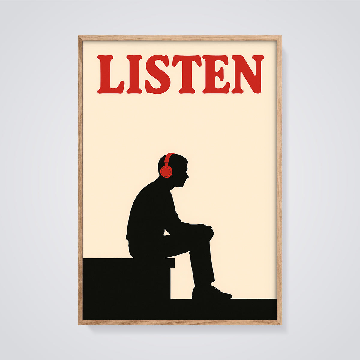 LISTEN Headphones Silhouette Print framed in oak on a grey background