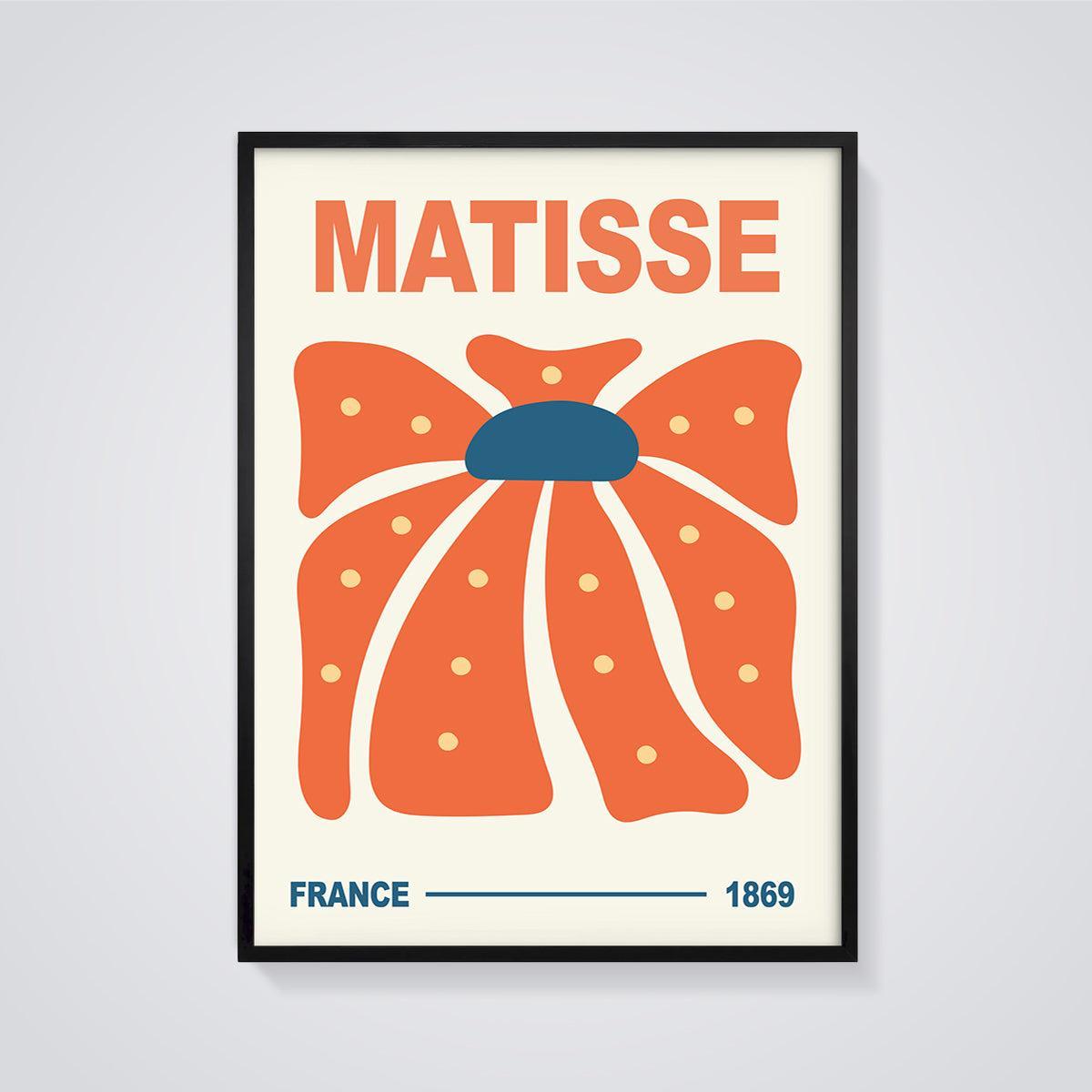 Matisse Orange Bloom Print framed in black on a grey background