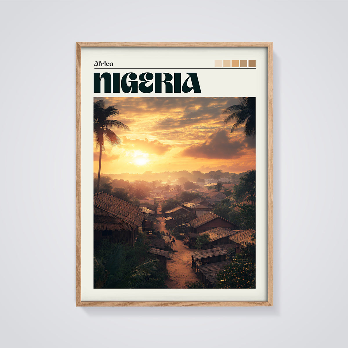 Nigeria Village Sunset Print framed in oak on a grey background