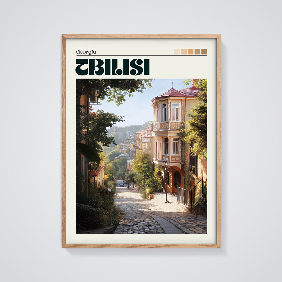Old Tbilisi Cobblestone Street Print framed in oak on a grey background