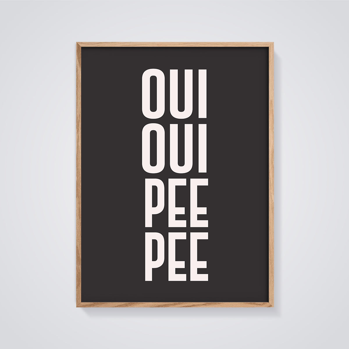 Oui Oui Pee Pee Print framed in oak on a grey background