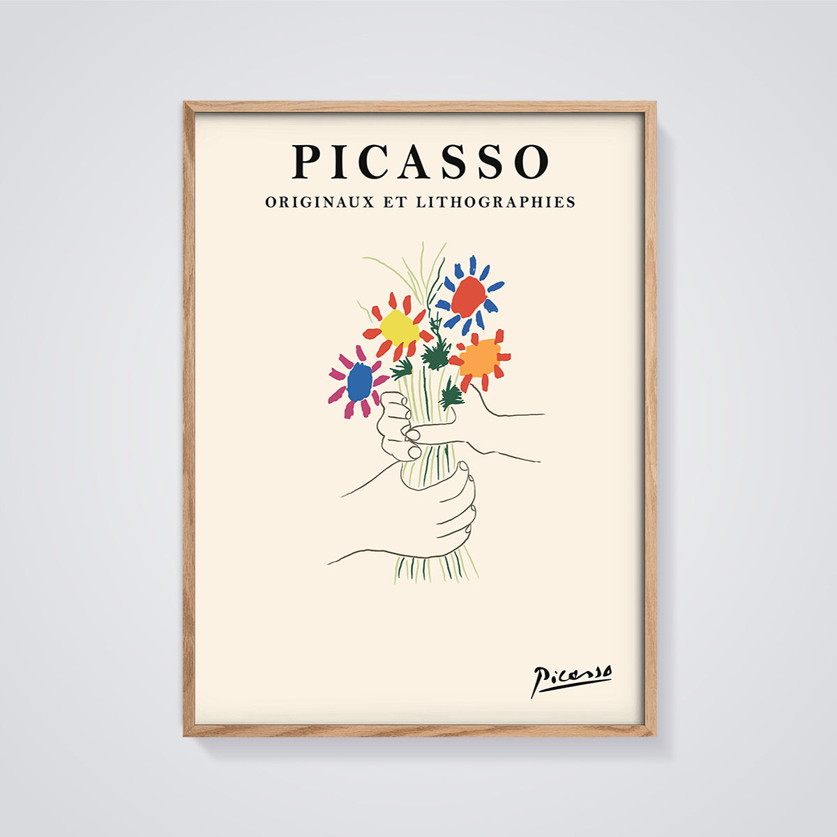 Picasso Hands with Flowers Print framed in oak on a grey background