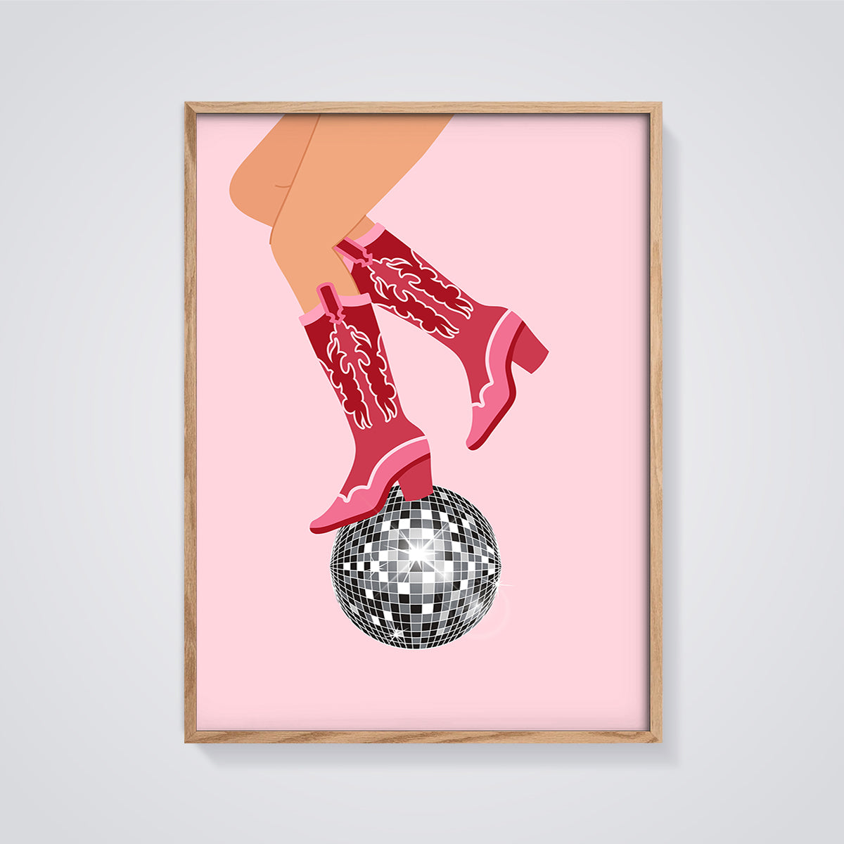 Pink Cowboy Boots Disco Print framed in oak on a grey background