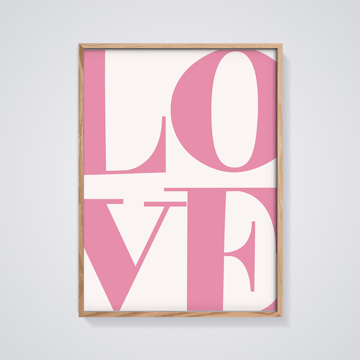 Pink LOVE Typography Print framed in oak on a grey background