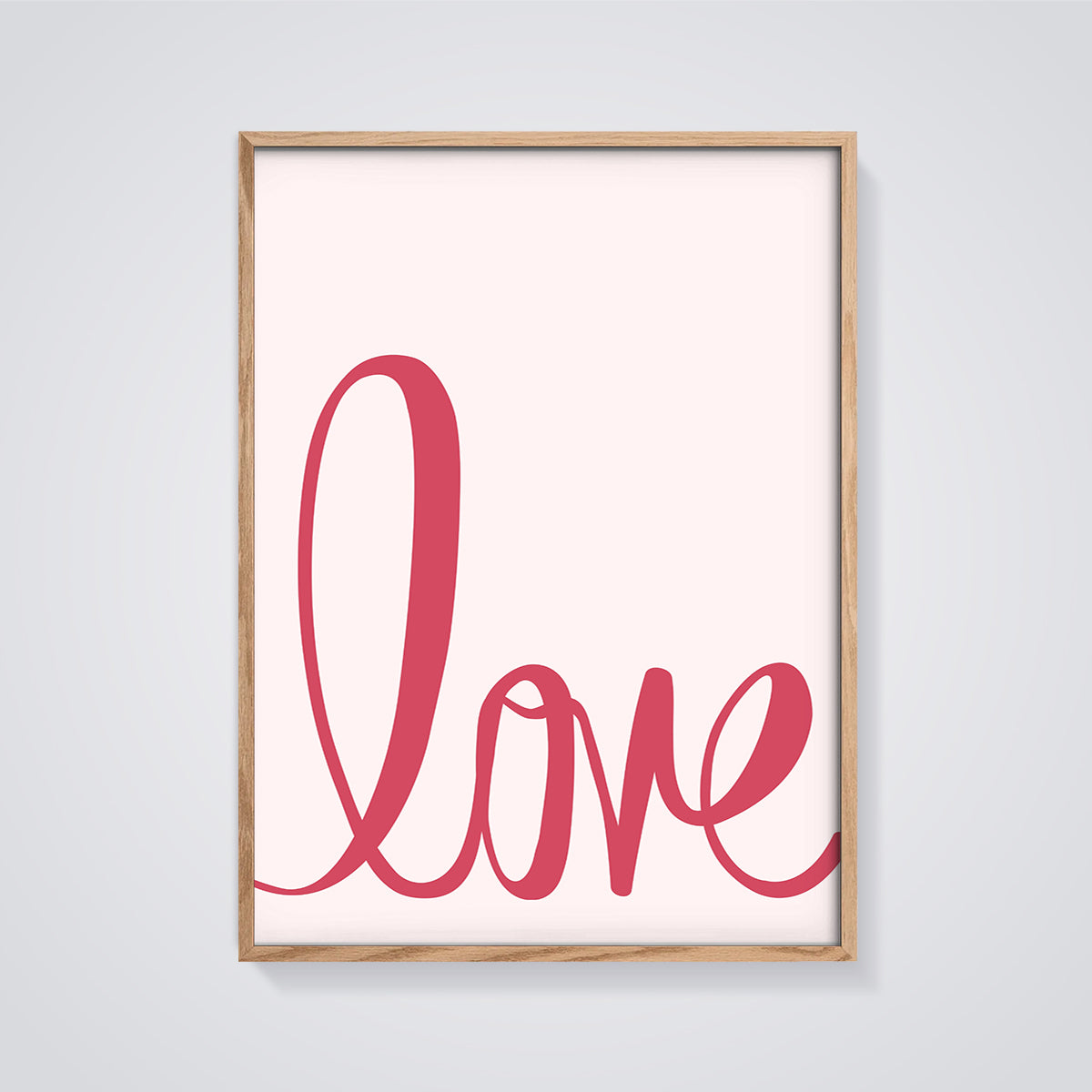 Pink Love Script Print framed in oak on a grey background
