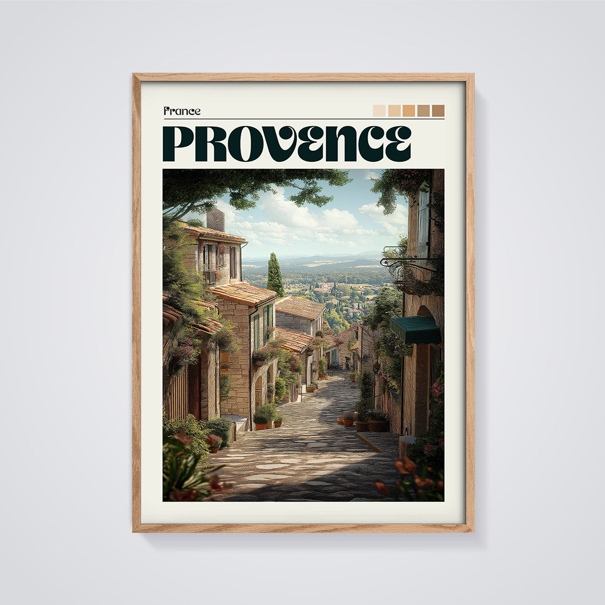 Provence Cobblestone Street Print framed in oak on a grey background