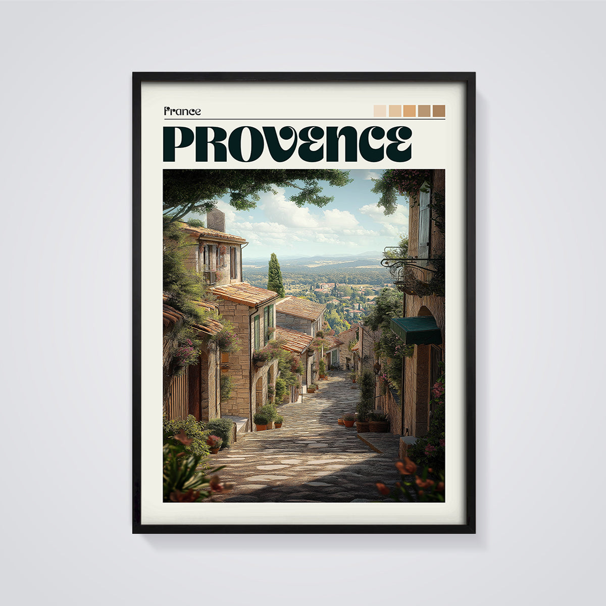Provence Cobblestone Street Print framed in black on a grey background