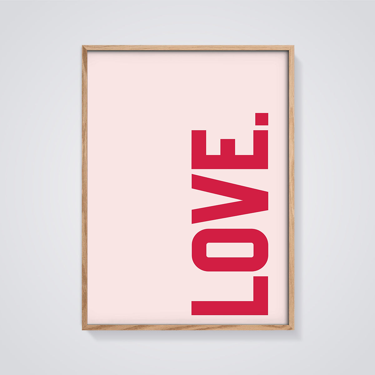 Red LOVE Typography Print framed in oak on a grey background