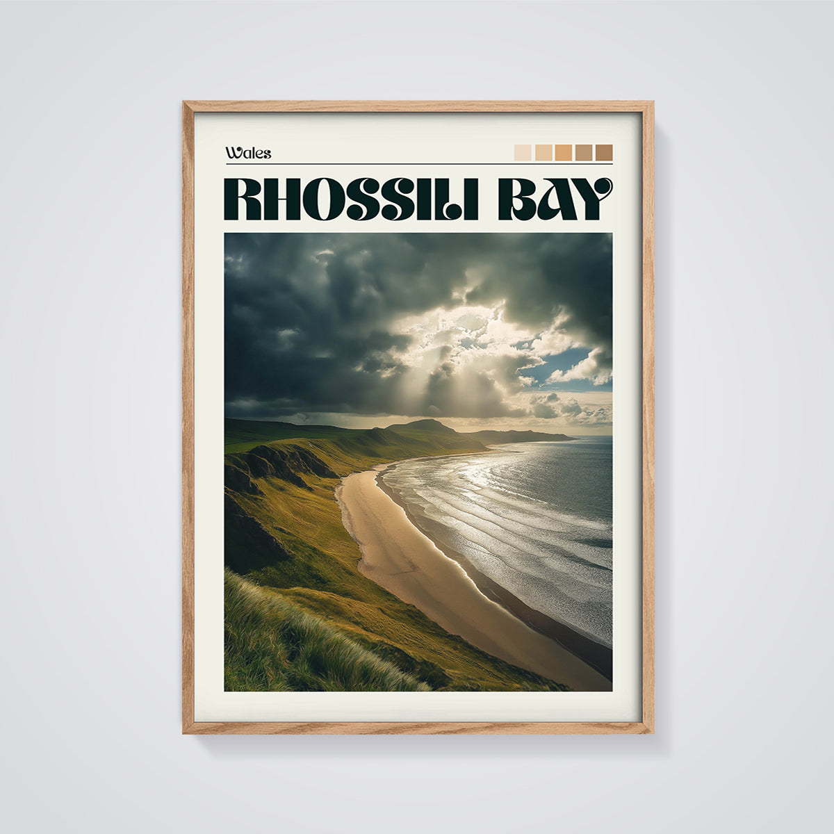 Rhossili Bay Sun Rays Print framed in oak on a grey background