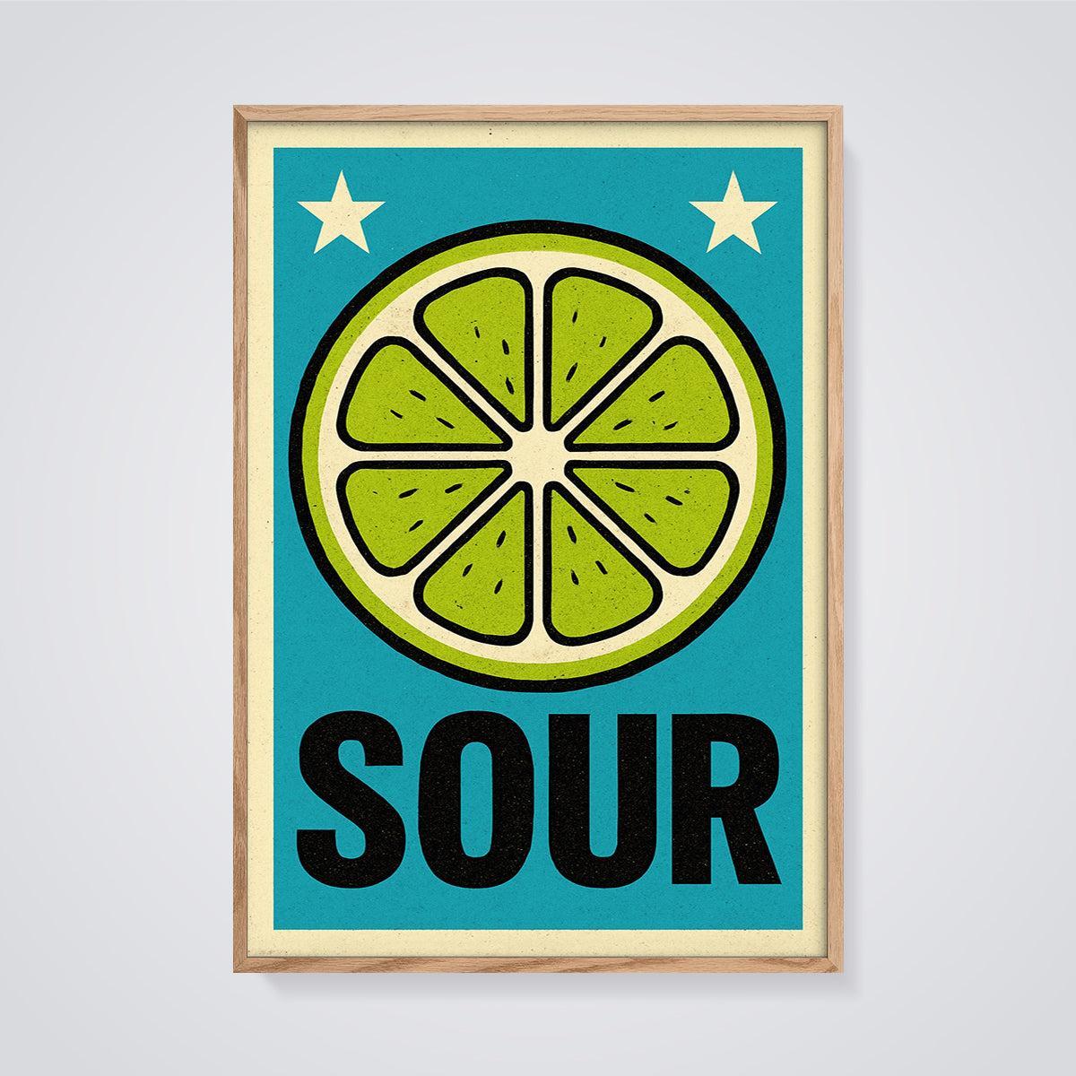 Sour Lime Slice Print framed in oak on a grey background