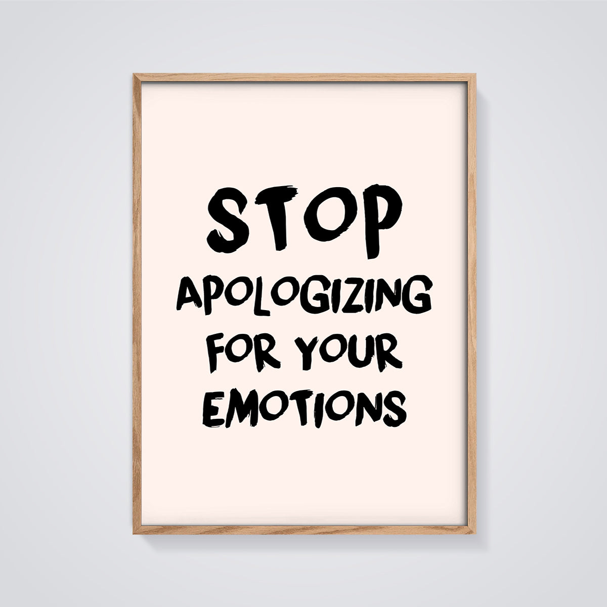 Stop Apologizing Emotions Print framed in oak on a grey background