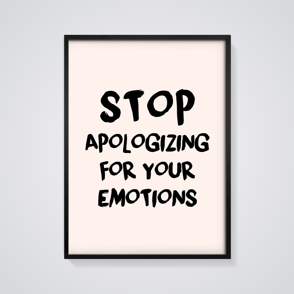 Stop Apologizing Emotions Print framed in black on a grey background