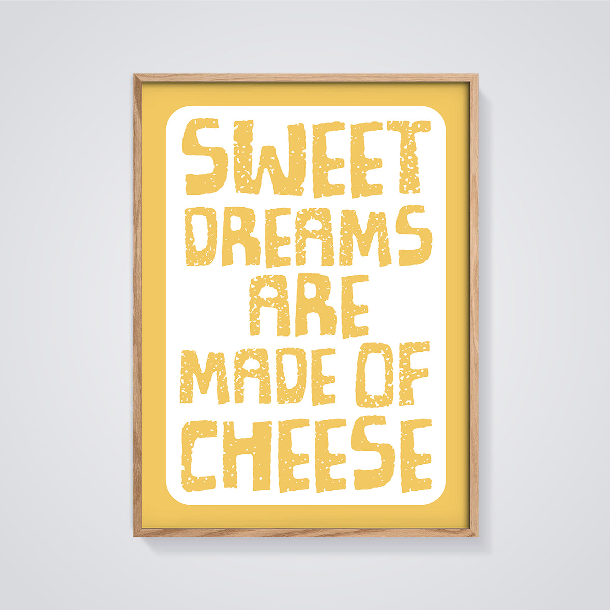 Sweet Dreams Are Made of Cheese Print framed in oak on a grey background