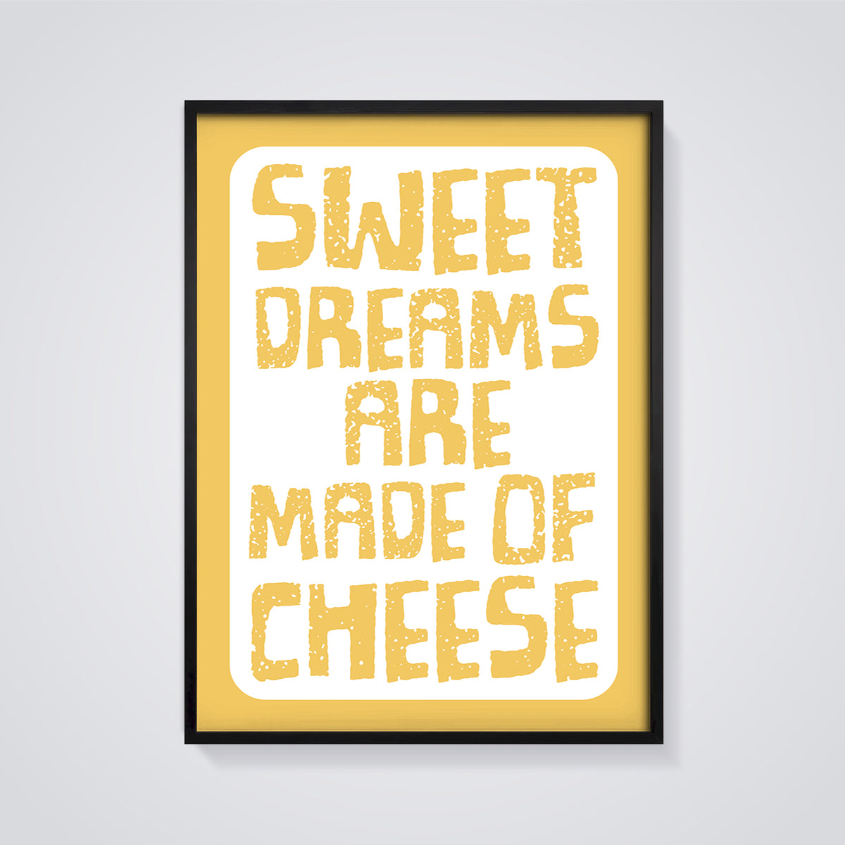 Sweet Dreams Are Made of Cheese Print framed in black on a grey background