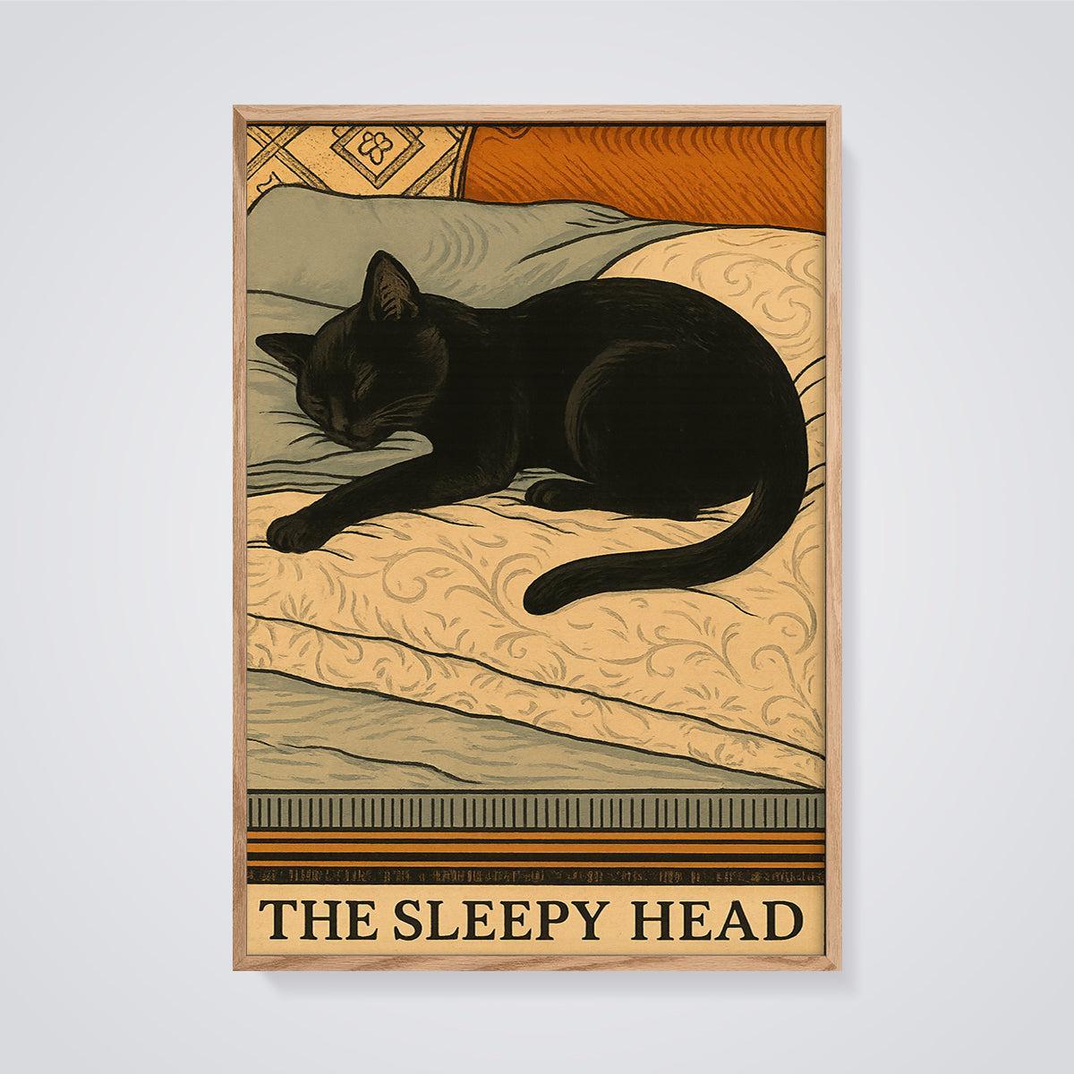 The Sleepy Head Black Cat Print framed in oak on a grey background