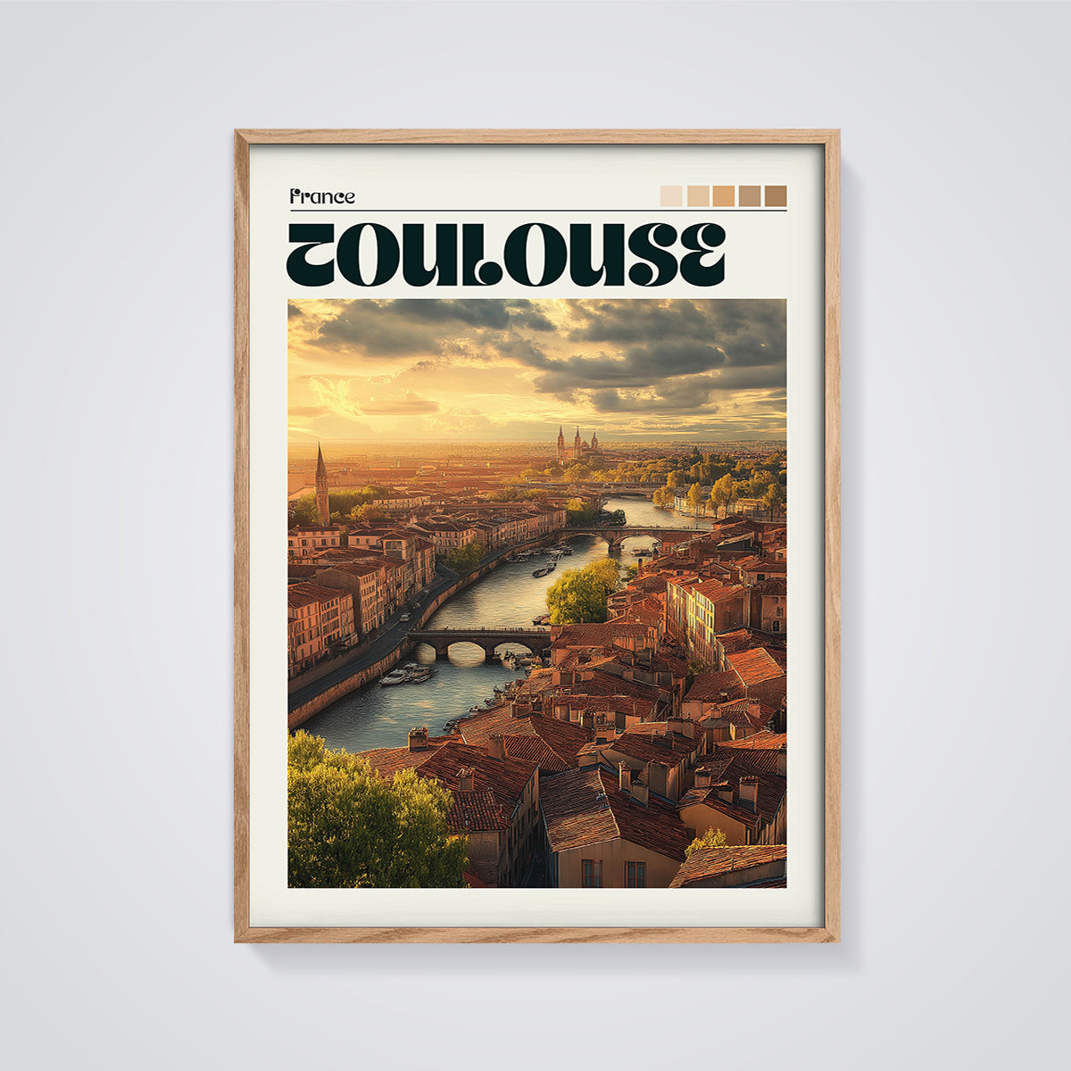 Toulouse Sunset Cityscape Print framed in oak on a grey background
