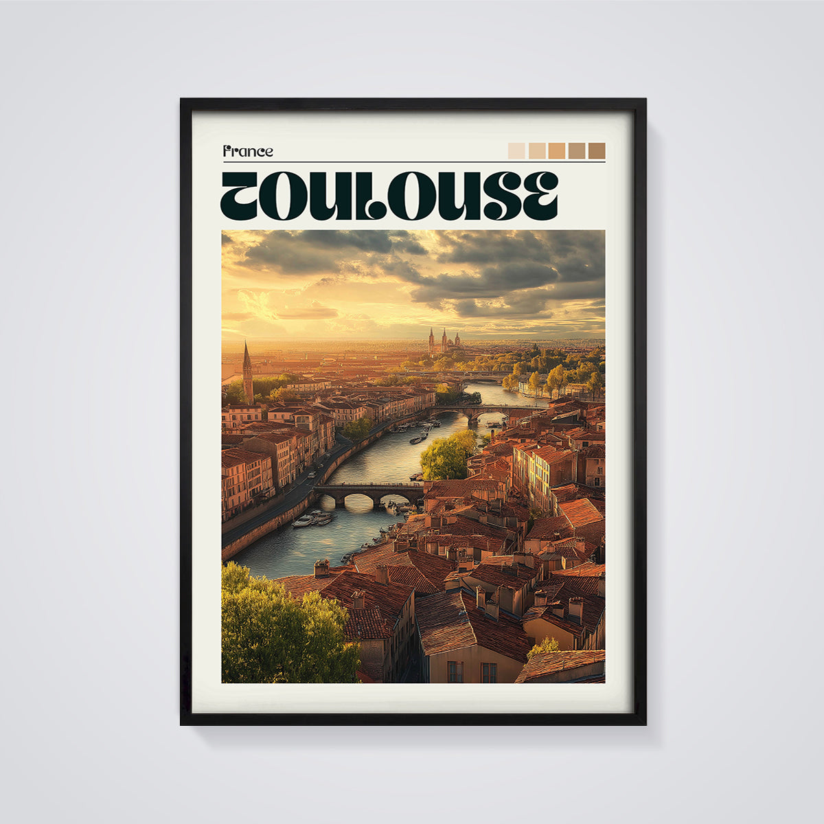 Toulouse Sunset Cityscape Print framed in black on a grey background
